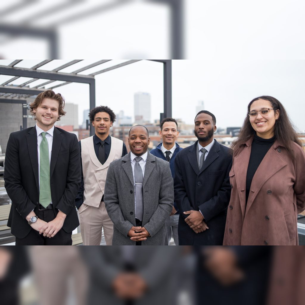 The Reign Consulting team standing together outside the office
